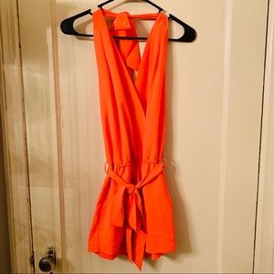 Backless neon orange overall shorts
